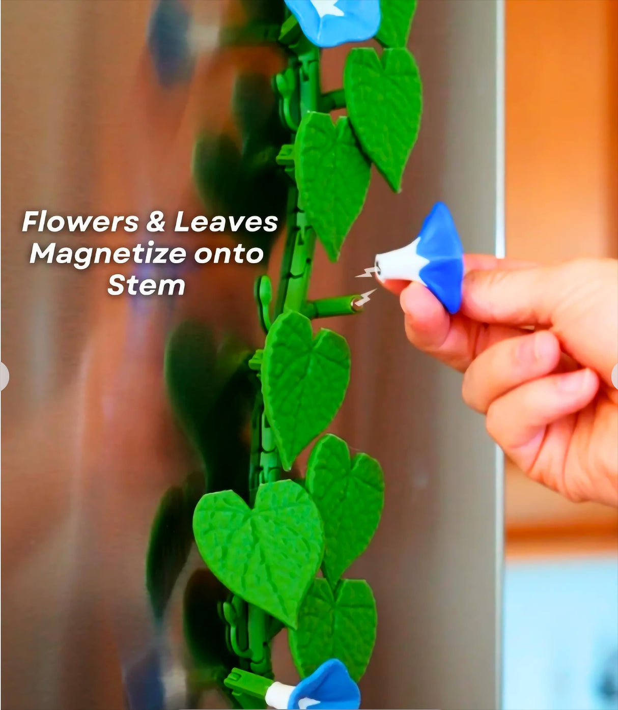 Customizable Morning Glory fridge magnets with flower and leaf designs attaching to a flexible green stem.