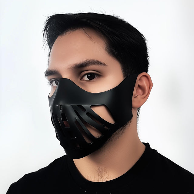 Futuristic warrior face mask on a model, featuring a sleek black 3D printed design with angular cutouts for cosplay.