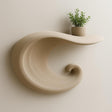 Wave-inspired 3D printed floating shelf with potted plant for minimalist home decor.