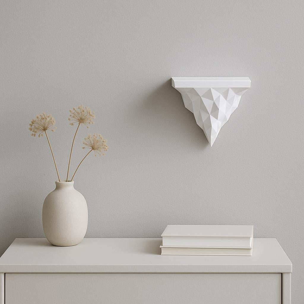 Geometric 3D printed wall shelf in white, showcasing a minimalist design with a vase and books for modern decor.