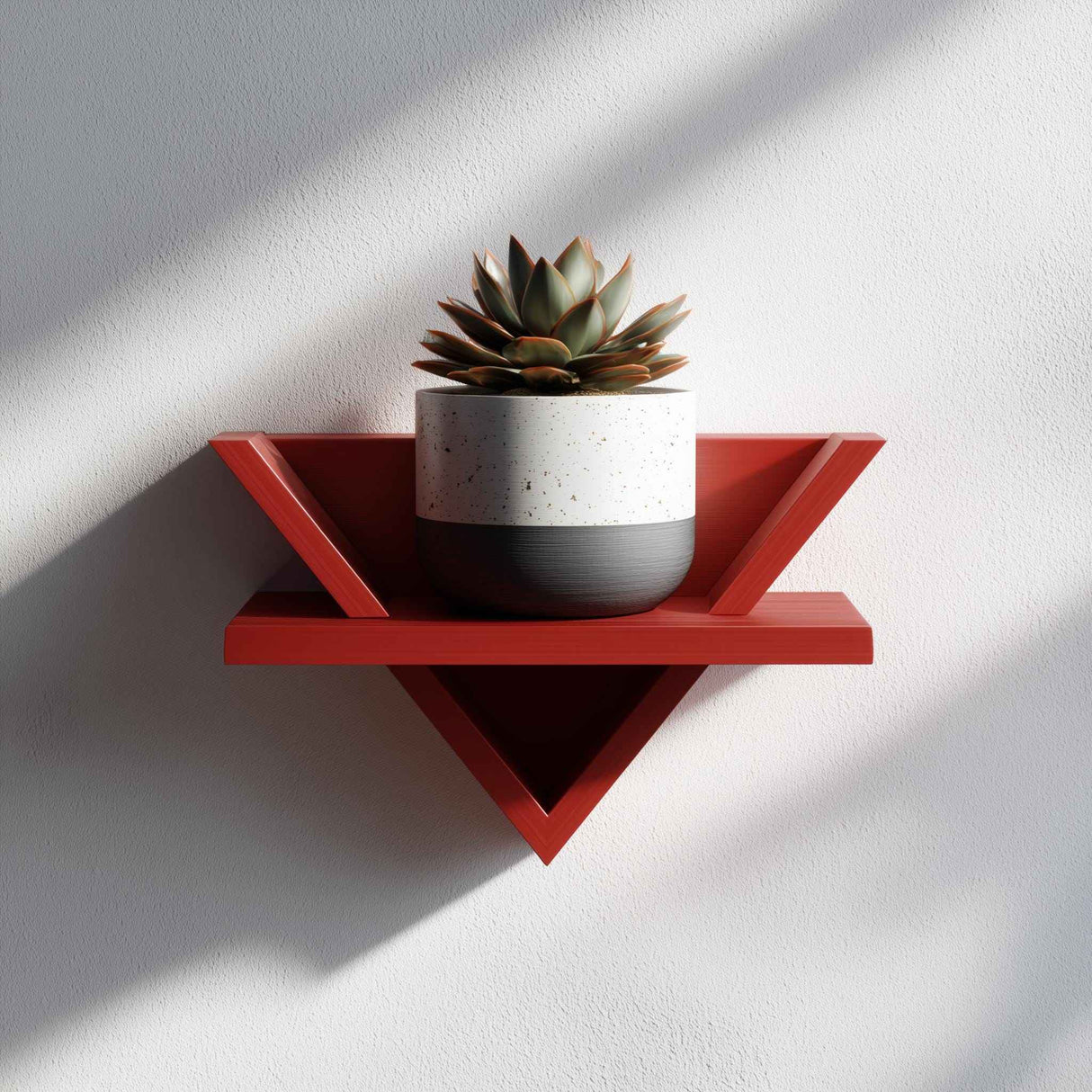 3D printed triangular wall shelf in modern design, displayed with a small potted plant, minimalist aesthetic wall decor