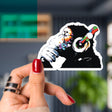 Colorful primate music-themed vinyl sticker decal of a chimp with headphones, perfect for personalizing laptops.