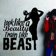Motivational wall sticker design featuring silhouette and quote: 'Look like a Beauty, Train like a Beast' in a fitness setting.