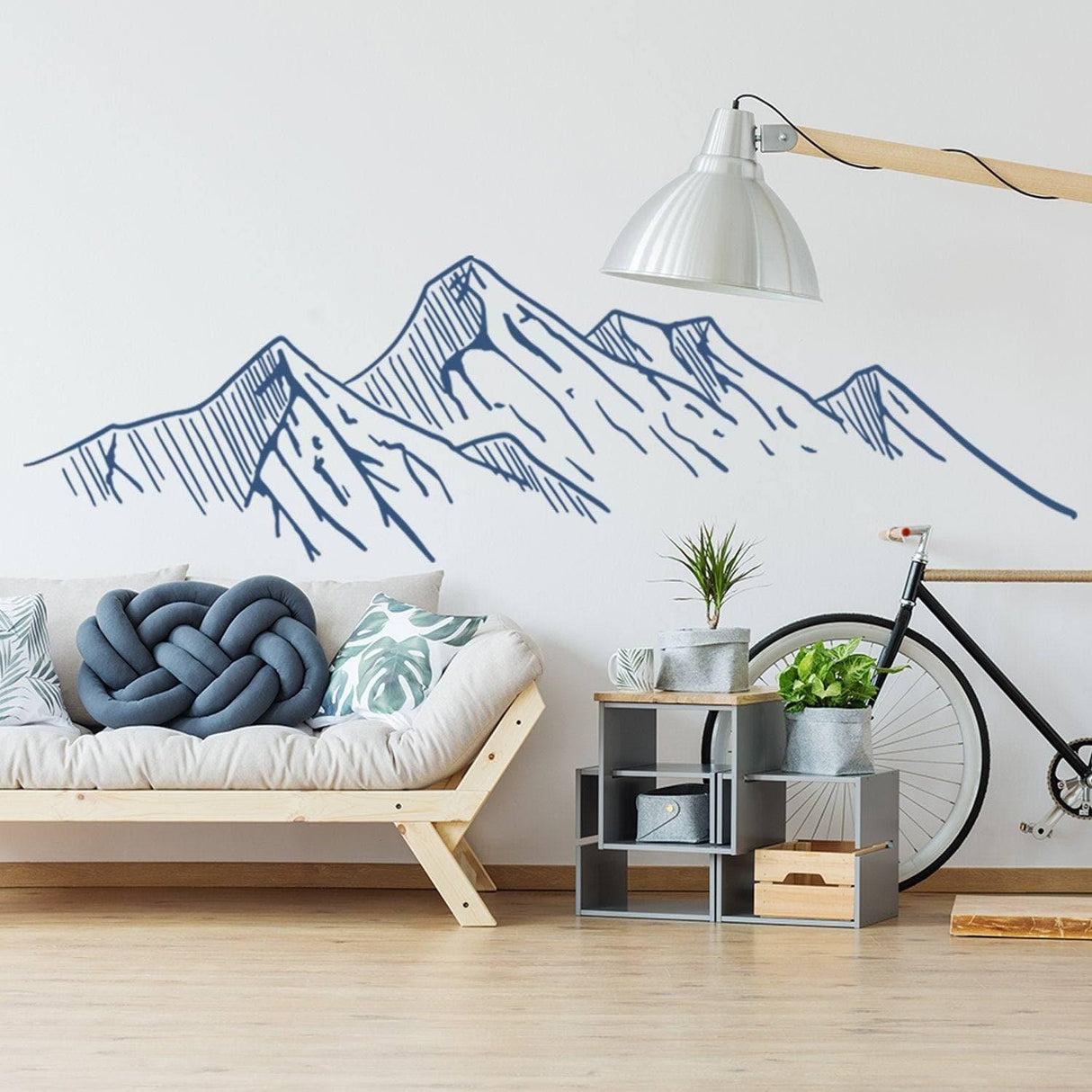 Mountain silhouette wall decal in a modern living room, enhancing nature-inspired decor and ambiance.
