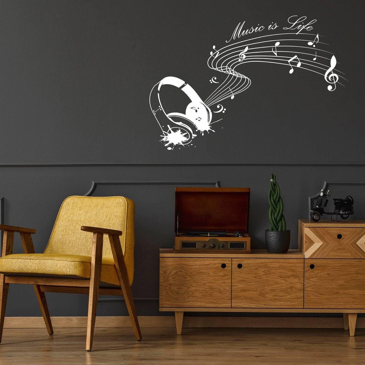 Wall sticker with the phrase 'Music is Life' and musical notes above a chair and record player in a stylish room.