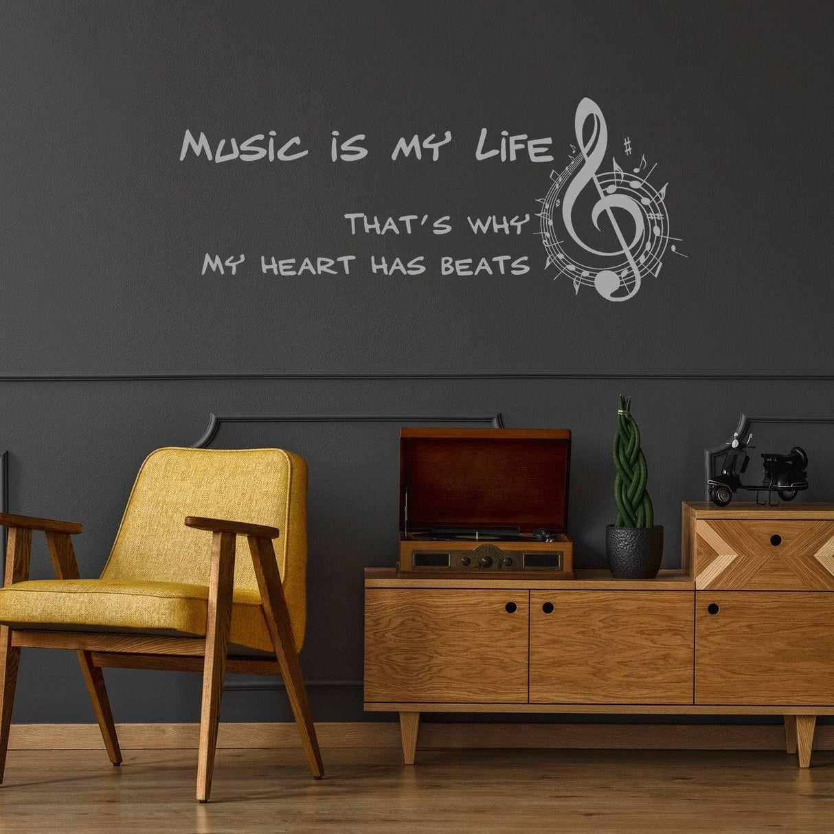 Music is my life wall sticker vinyl decal on a dark wall above a stylish chair and wooden console.