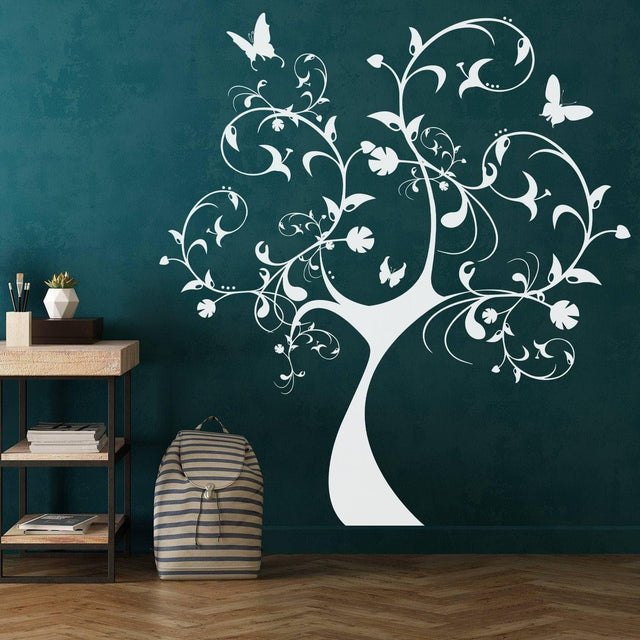 Nature's Delight wall stickers featuring a white tree design with butterflies on a dark green wall.