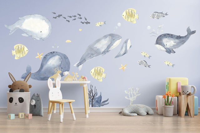 Undersea themed wall decals featuring playful whales and ocean creatures, perfect for a child's room decor.