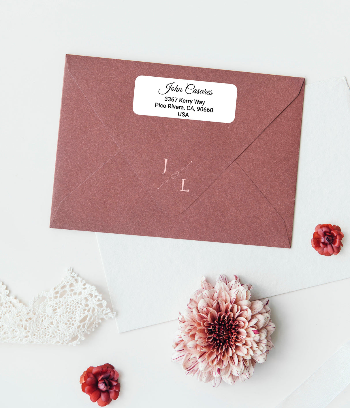 Customized mailing label on a burgundy envelope featuring stylish text for personalized touch.