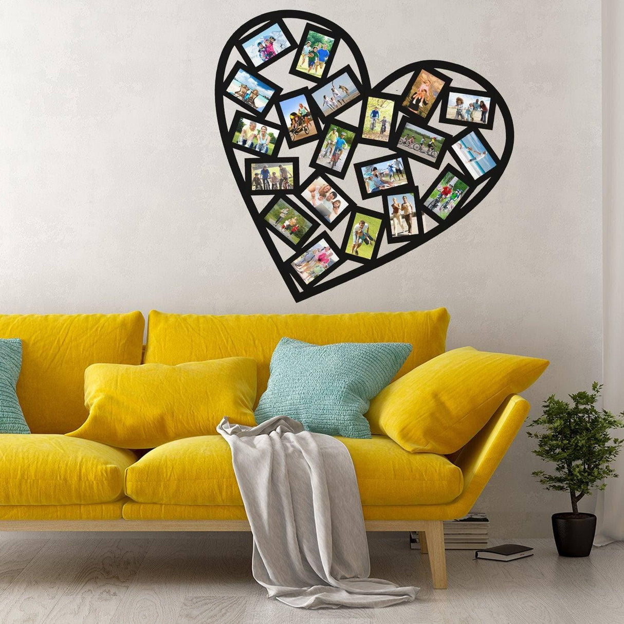 Heart-shaped photo frame wall decal above a bright yellow couch, showcasing personal memories and stylish decor.