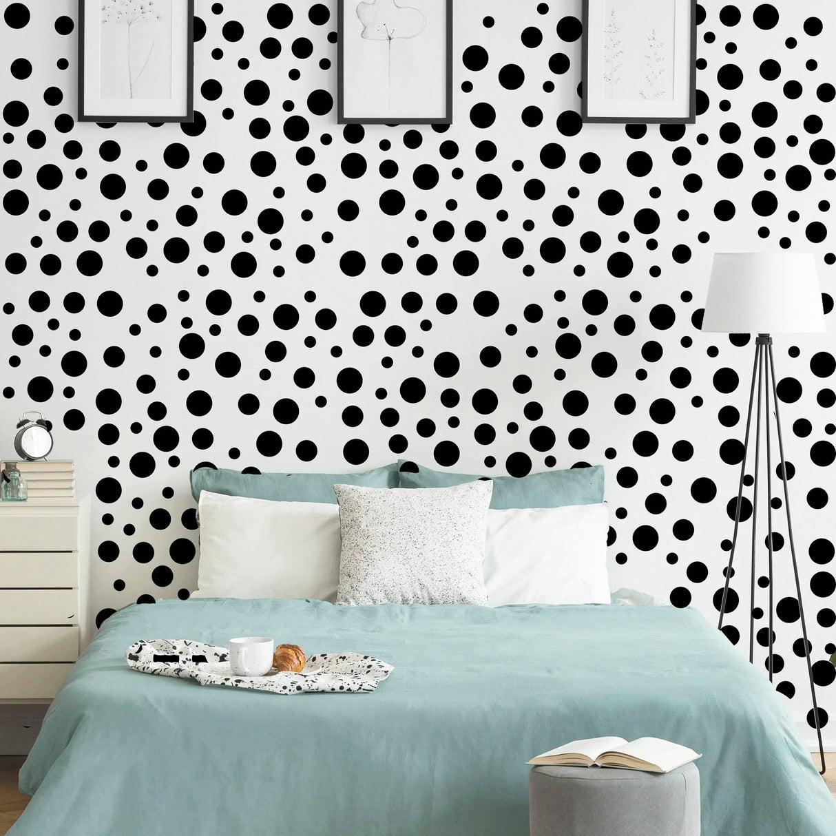 Vinyl circle wall decals in black on white background, adding whimsy to a stylish bedroom decor.