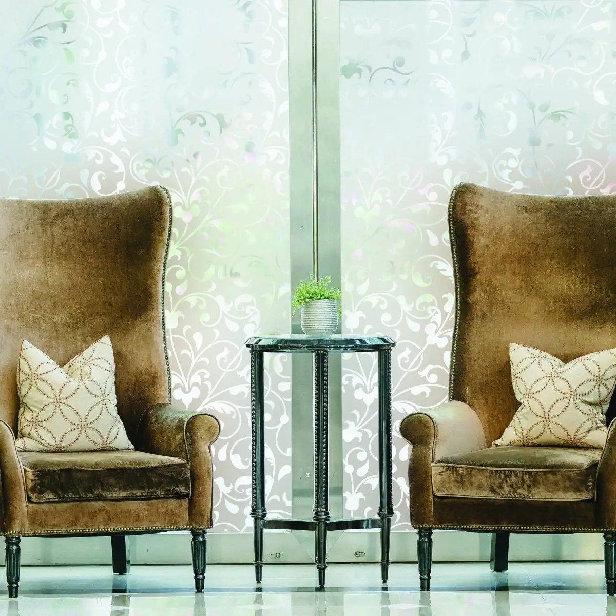 Stylish frosted privacy window film in a bright room with two elegant chairs and a decorative table.