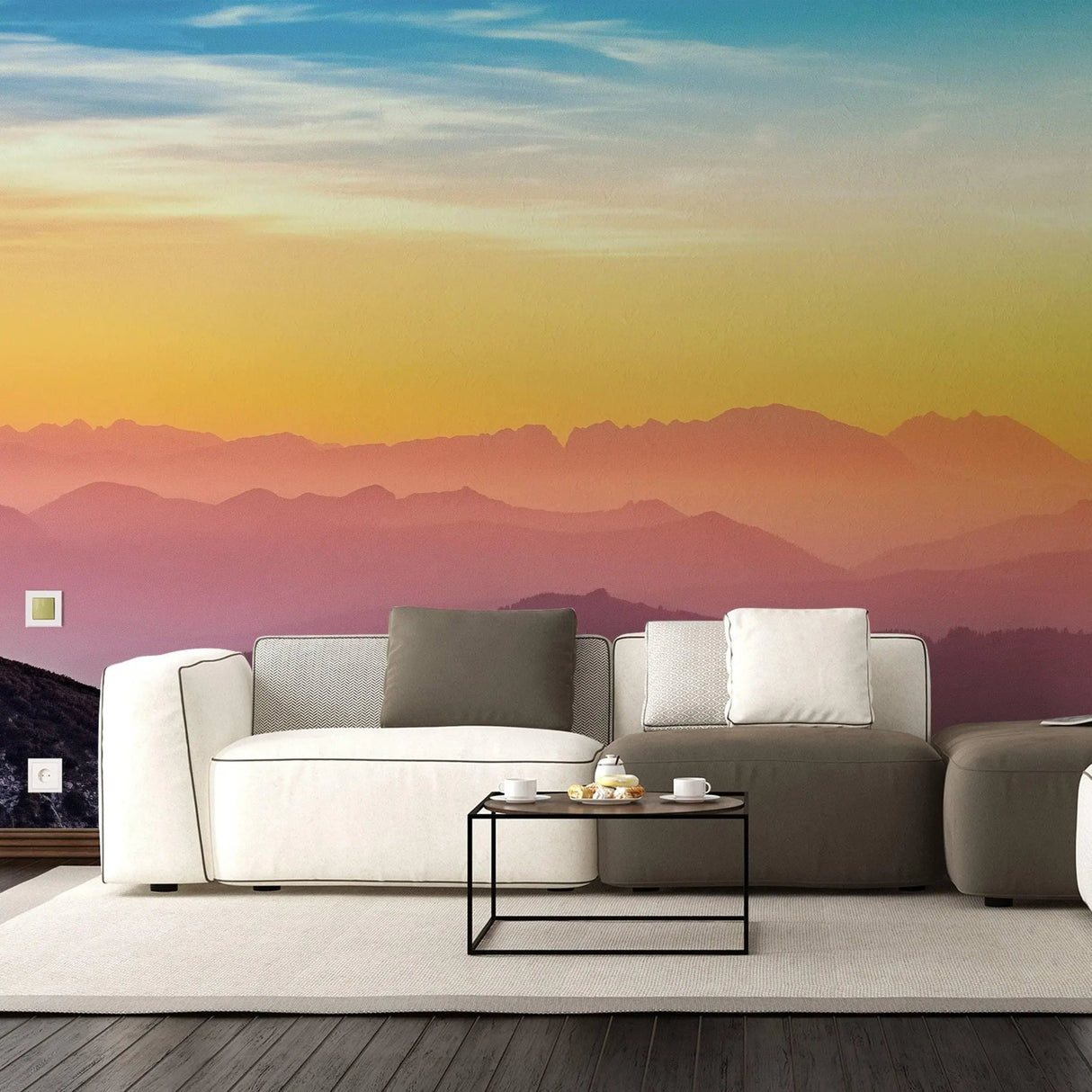 Modern living room with sunset wall decals, featuring vibrant orange and purple hues, stylish couch, and coffee table.