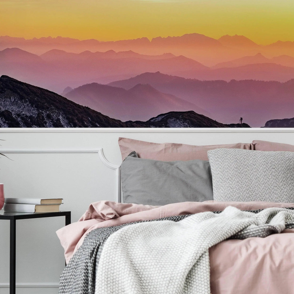 Transformative sunset wall decals featuring vibrant colors enhancing a cozy bedroom atmosphere.