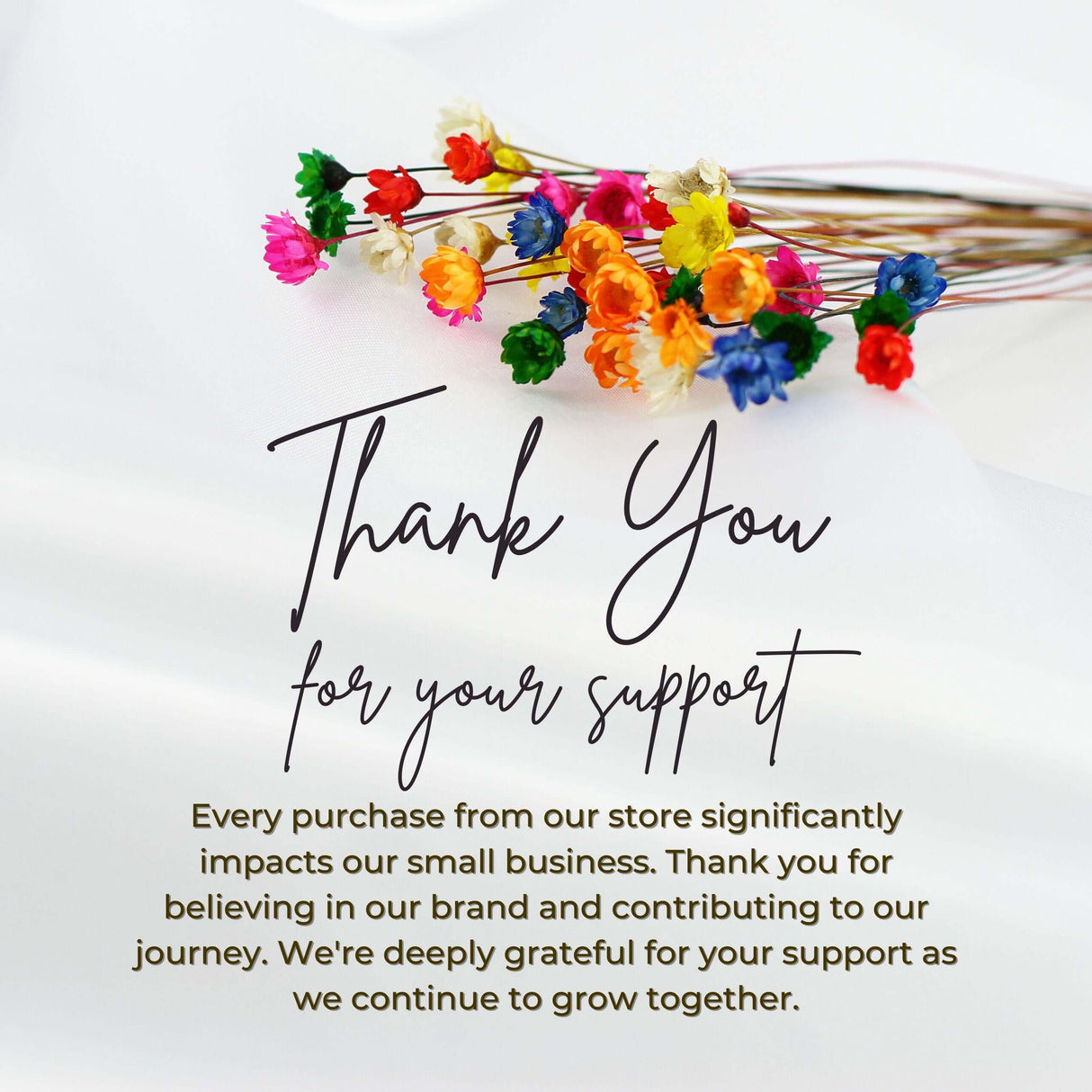 Colorful paper flowers with a heartfelt thank you message for customer support.