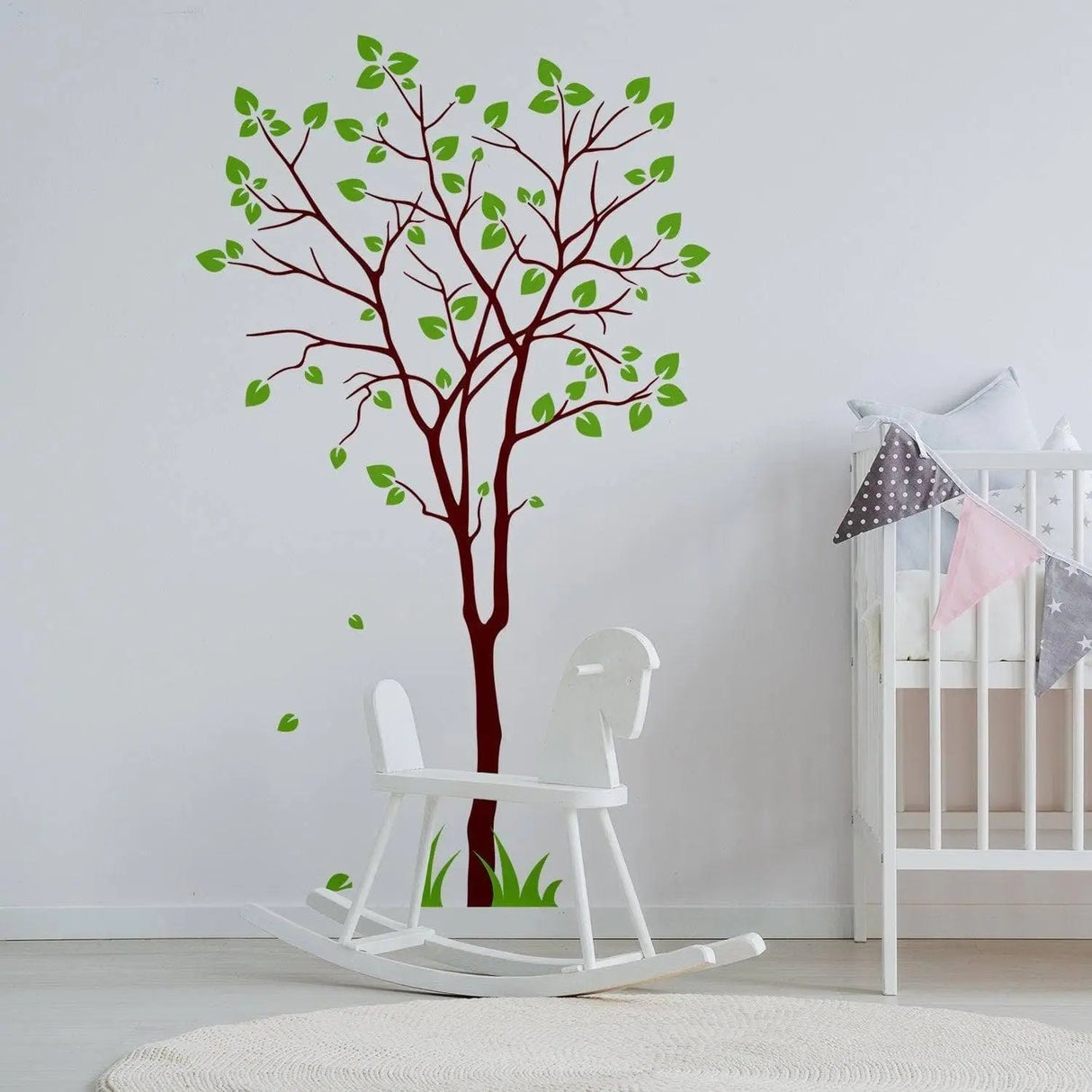 Nature's Serenity vinyl wall decal of a tree with green leaves in a nursery with a rocking horse.