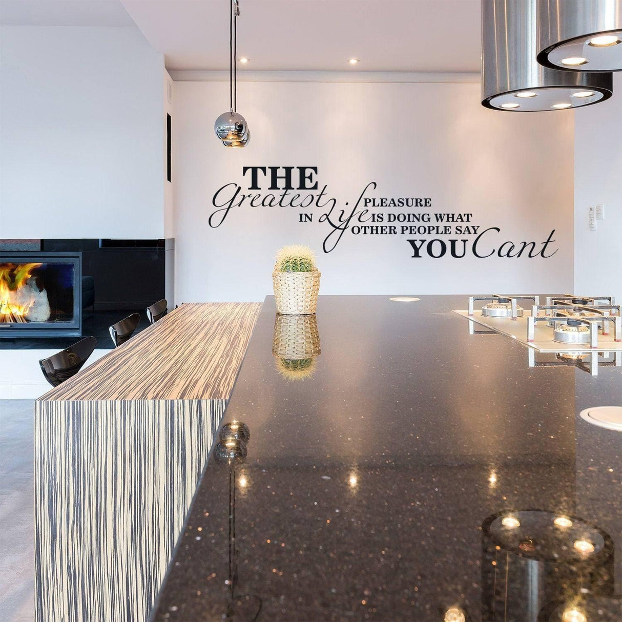 Inspirational wall decal in modern kitchen with motivational quote on wall above stylish countertop.