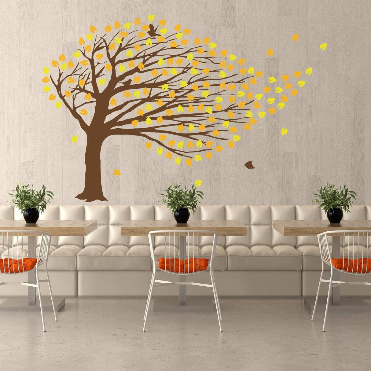 Decorative Windy Tree Wall Sticker with yellow leaves in a modern cafe setting.