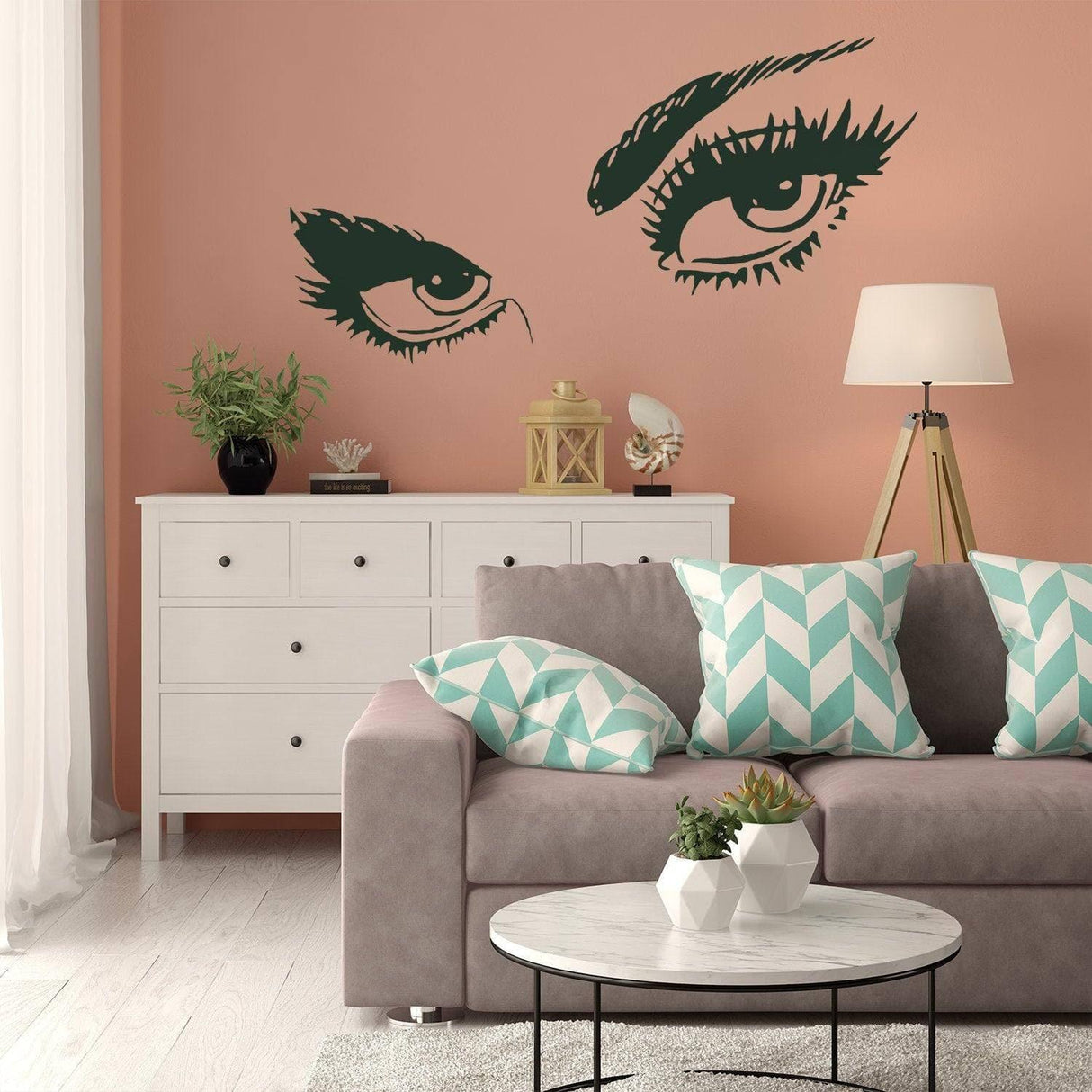 Chic vinyl wall decal featuring elegant woman eyes, enhancing modern living room decor with style.