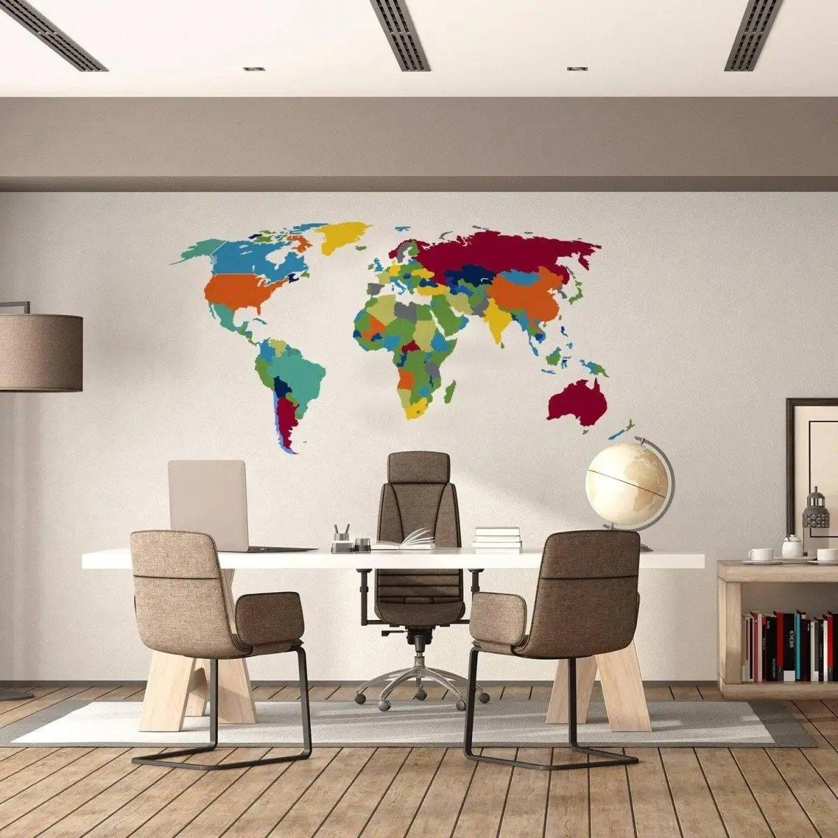 Colorful world map wall decal in modern office, showcasing adventure-themed decor for inspirational spaces.