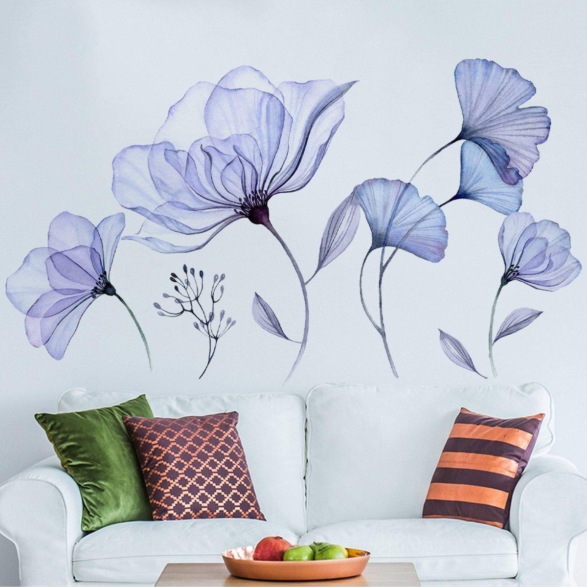 Elegant 3D blue blossom floral wall decal above a cozy couch with decorative pillows, adding charm to the living space.