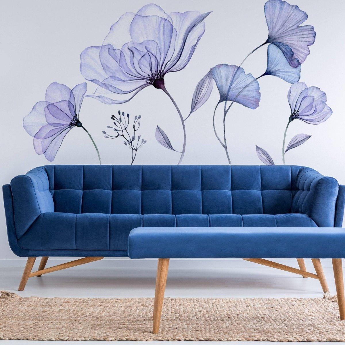 Elegant blue blossom wall decal above a stylish blue sofa in a modern living room setting.