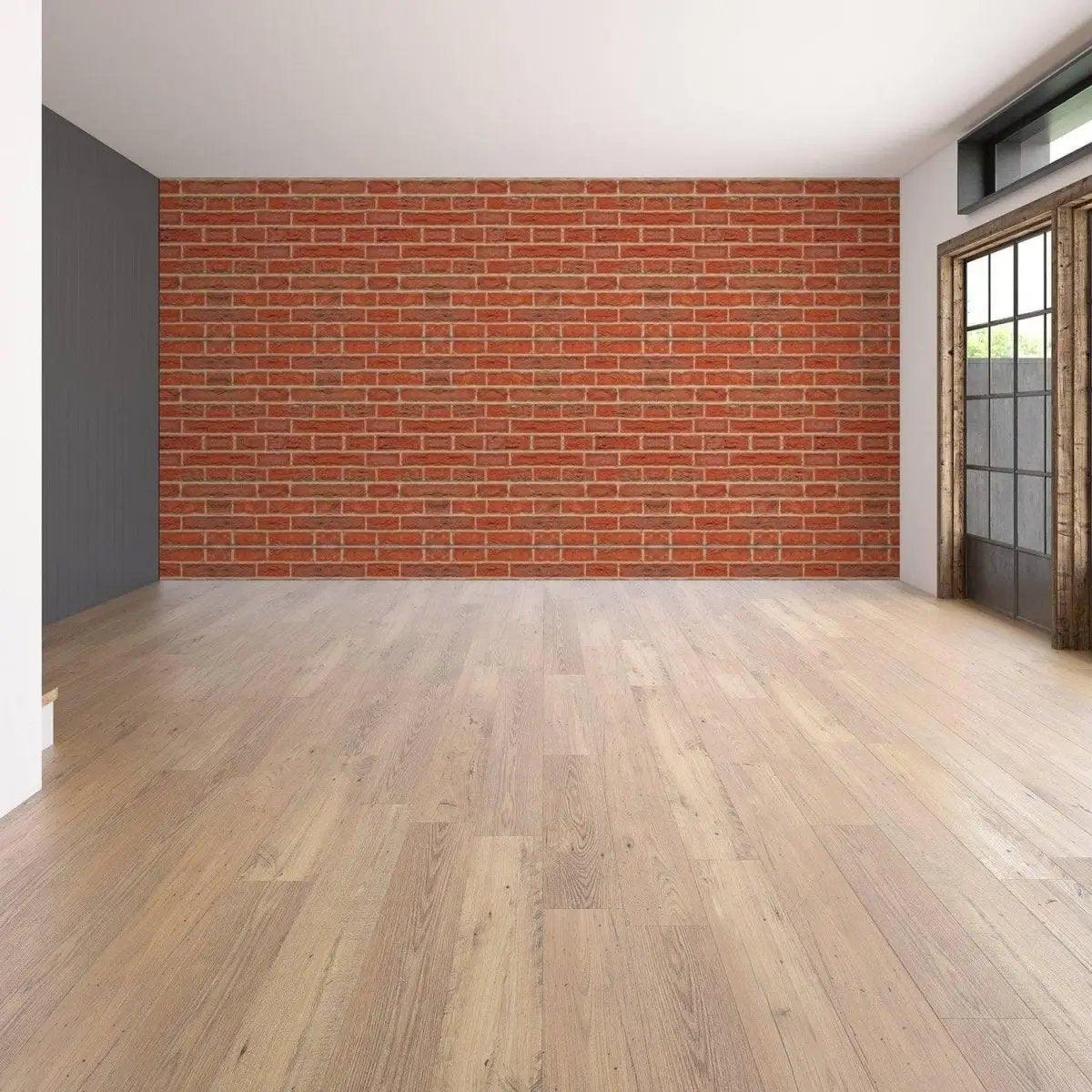 Living room with a brick self-adhesive wallpaper wall transformation, showcasing an elegant design and warm tones.