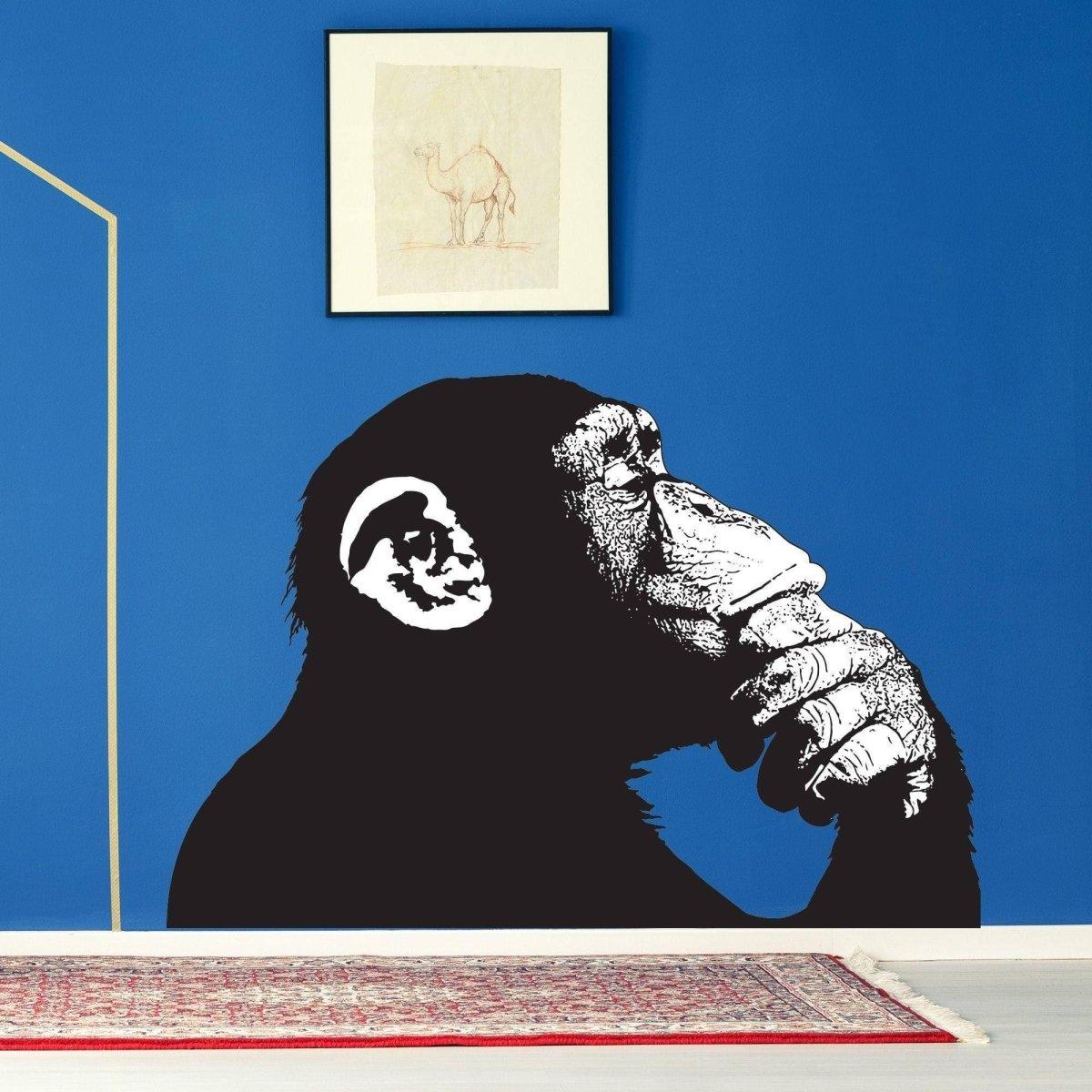 Thinking Monkey wall decal on blue wall, showcasing contemporary street art style and artistic design.