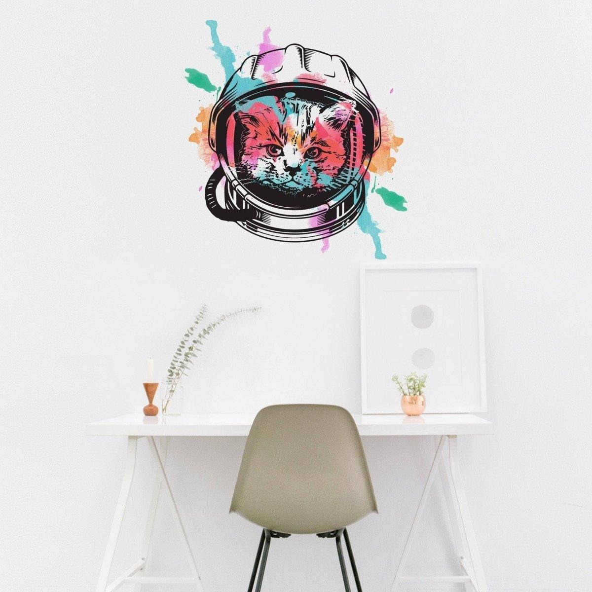 Whimsical astronaut kitty wall decal with colorful splashes, perfect for kids' rooms or nurseries.
