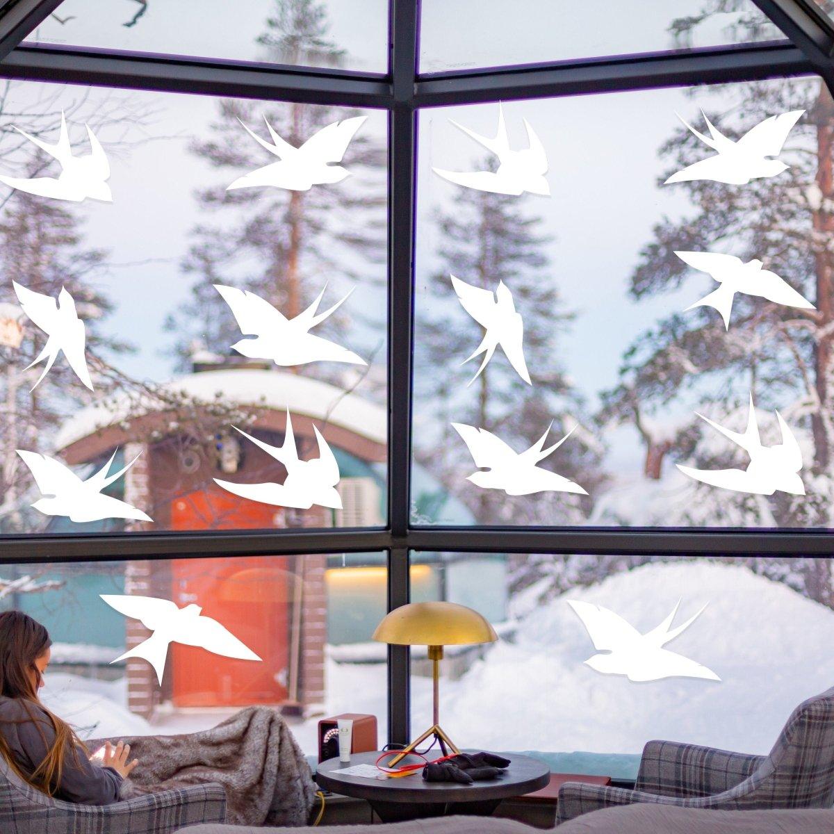 Window decal set featuring frosted bird silhouettes for bird strike protection, enhancing home aesthetics.