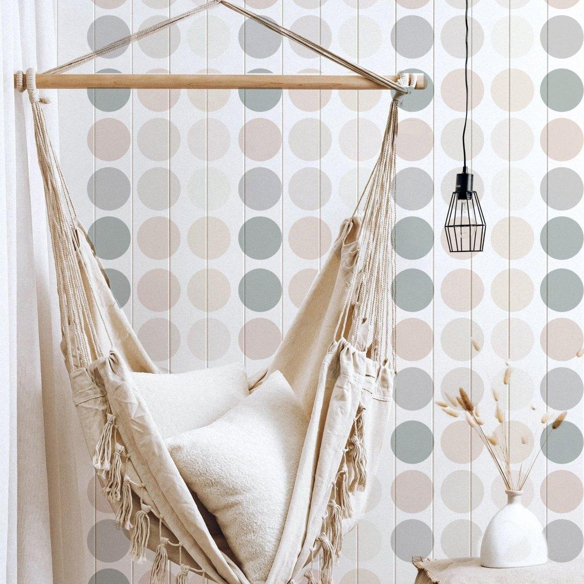 Cozy hammock chair against a vibrant boho circle wall decal backdrop in a stylish, modern room.