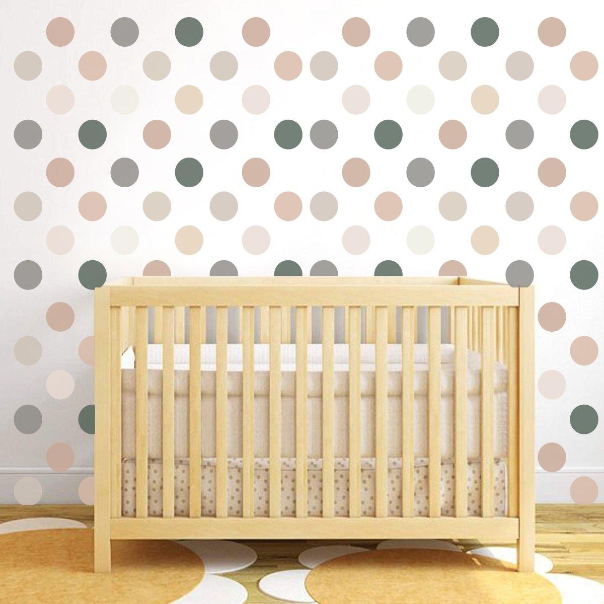 Boho circle wall decals in neutral colors above a wooden crib, adding a playful touch to a child's nursery.