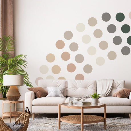Boho circle wall decals in earthy tones on a living room wall behind a sofa, enhancing home decor with playful design.