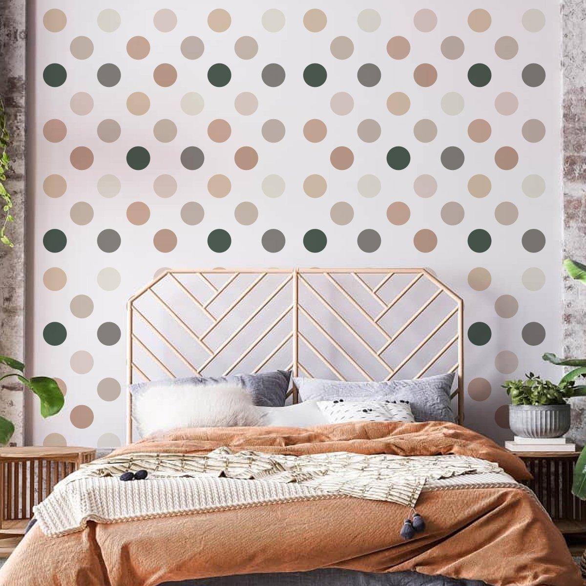 Boho circle wall decals in neutral tones on a bedroom wall behind a wooden bed frame with cozy bedding.