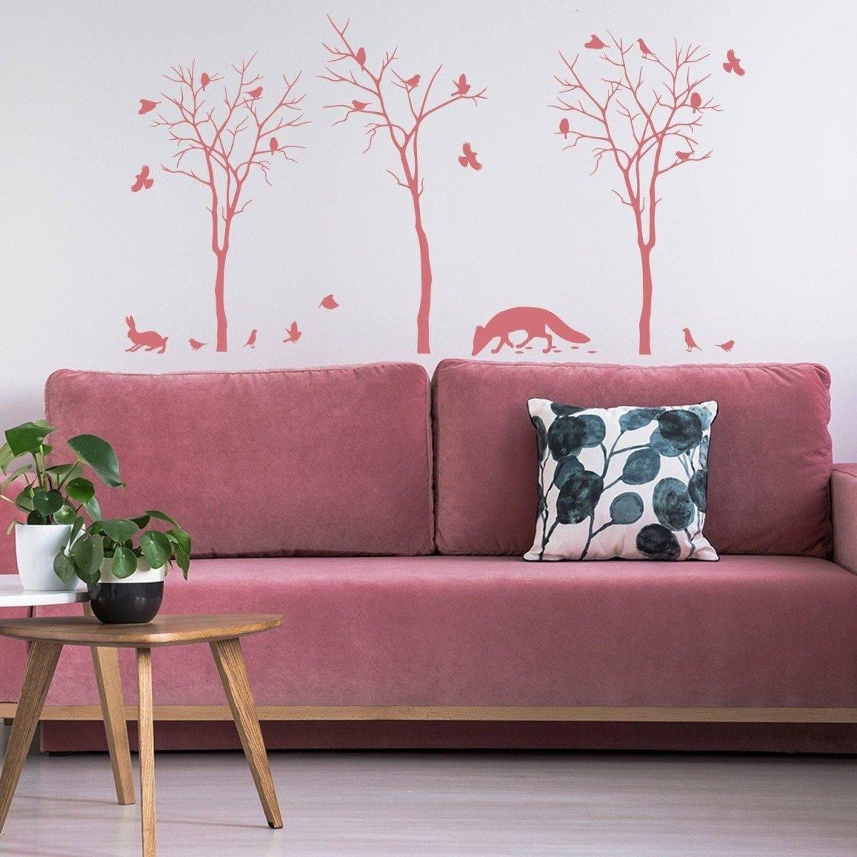 Botanical wildlife vinyl decal set featuring trees and cute animals, enhancing a cozy interior design with nature-inspired charm.