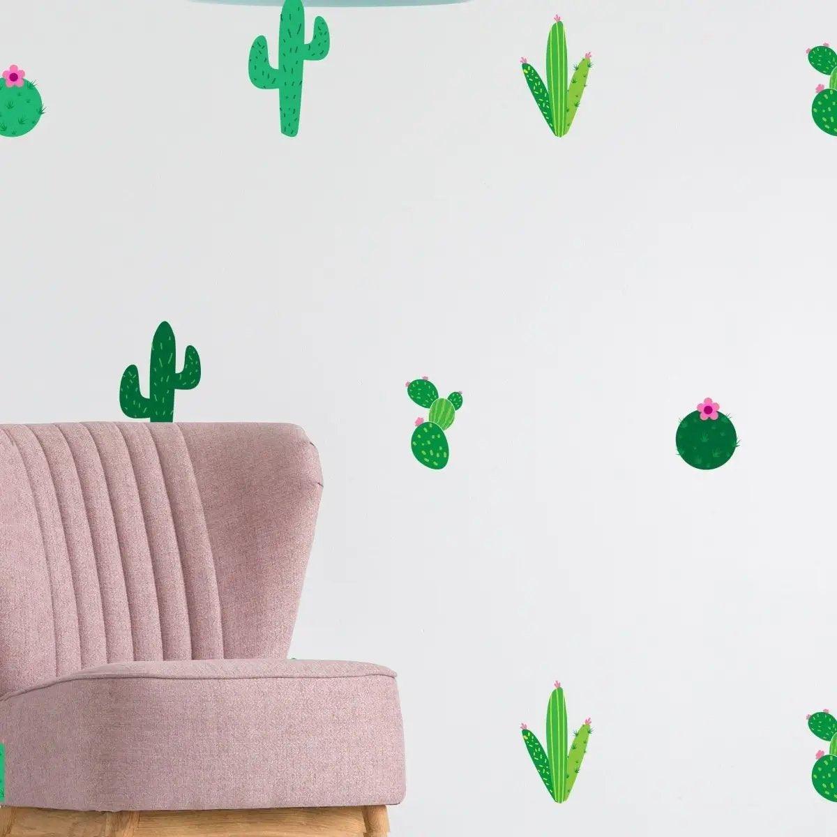 Cactus Oasis Vinyl Wall Decals on a wall with a pink chair, adding vibrant nature decor to the space.