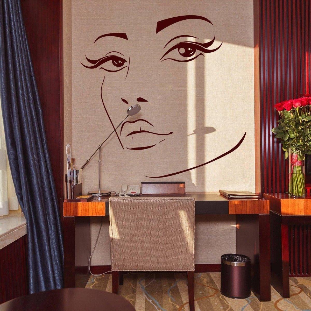 Charming woman face vinyl wall decal in elegant interior with desk and flowers, perfect for home decor.