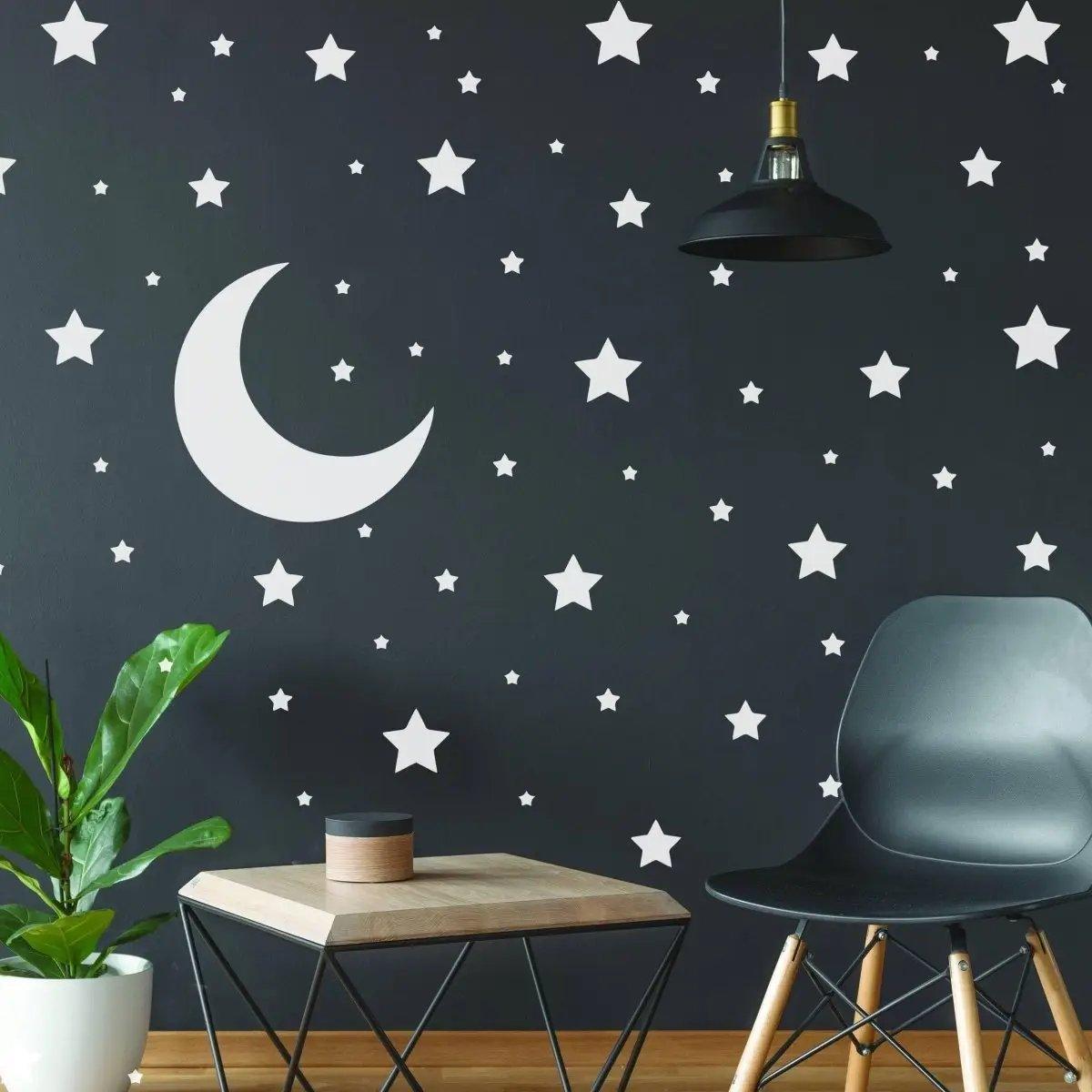 Celestial Dreams wall sticker collection featuring white stars and moon on a dark wall, perfect for space-themed decor.
