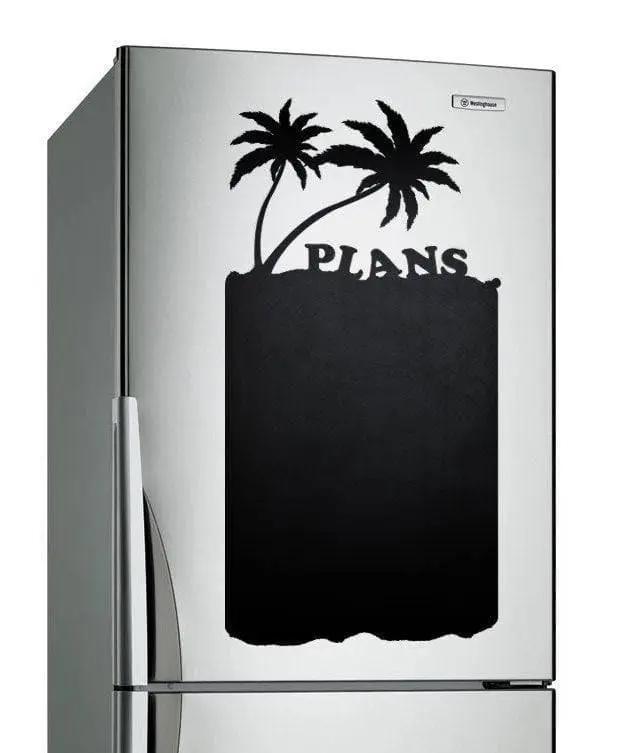 Magnetic chalkboard sticker on refrigerator with palm trees and 'PLANS' text for notes and organization.