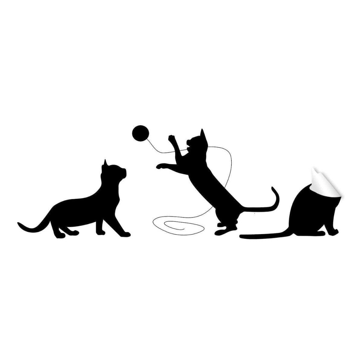 Adorable black cat silhouette vinyl sticker showcasing playful cats with a ball, perfect for cat lovers' wall art.
