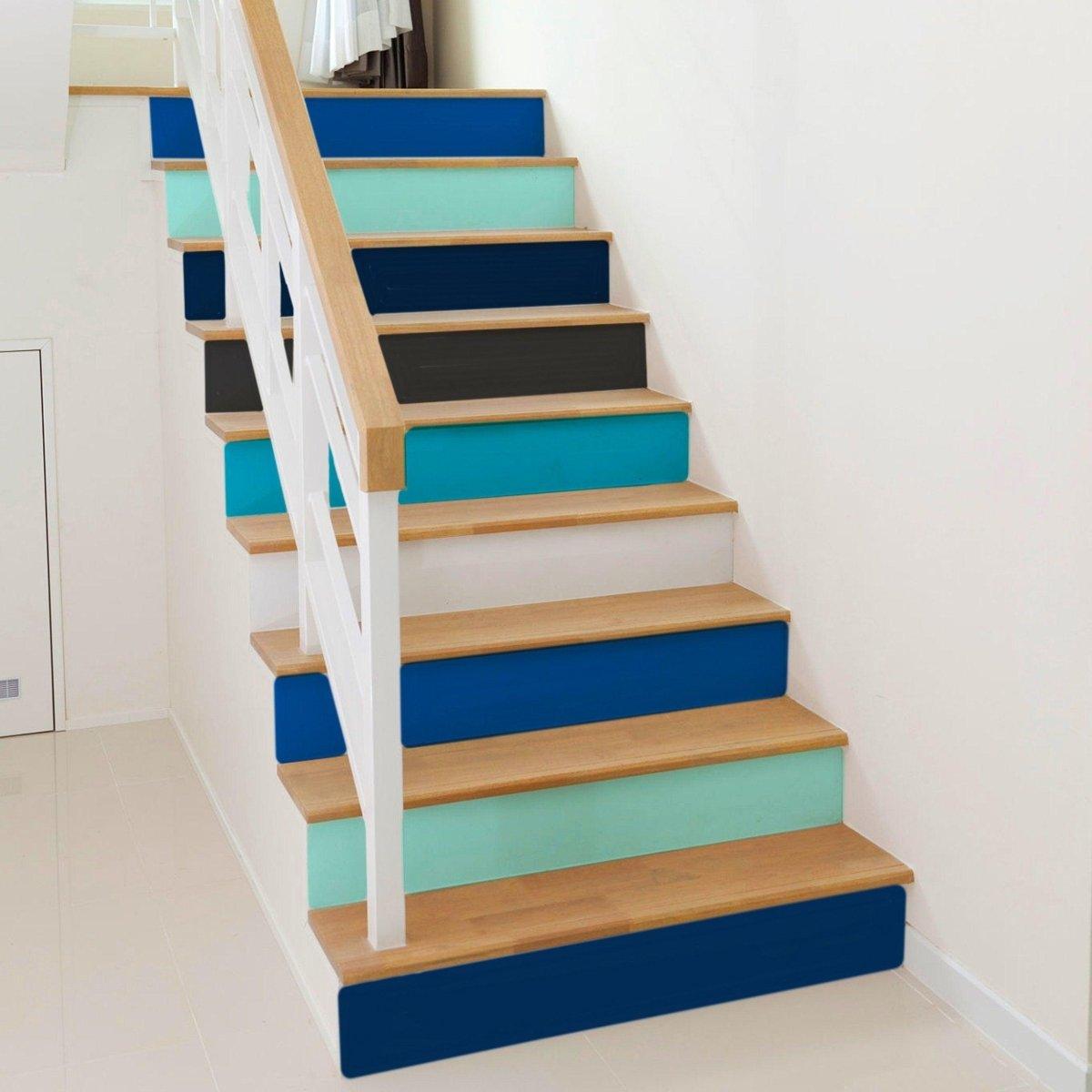 Vibrant staircase featuring gradient color riser stickers, adding personality and flair to a modern home.