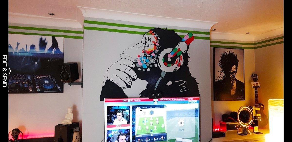 Contemplative monkey wall decal with headphones in a stylish room, perfect for kids or music lovers.