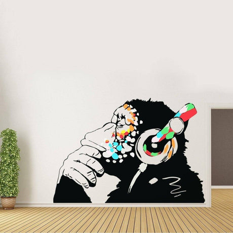 Contemplative monkey wall decal with headphones, perfect for kids' rooms and fun decoration.