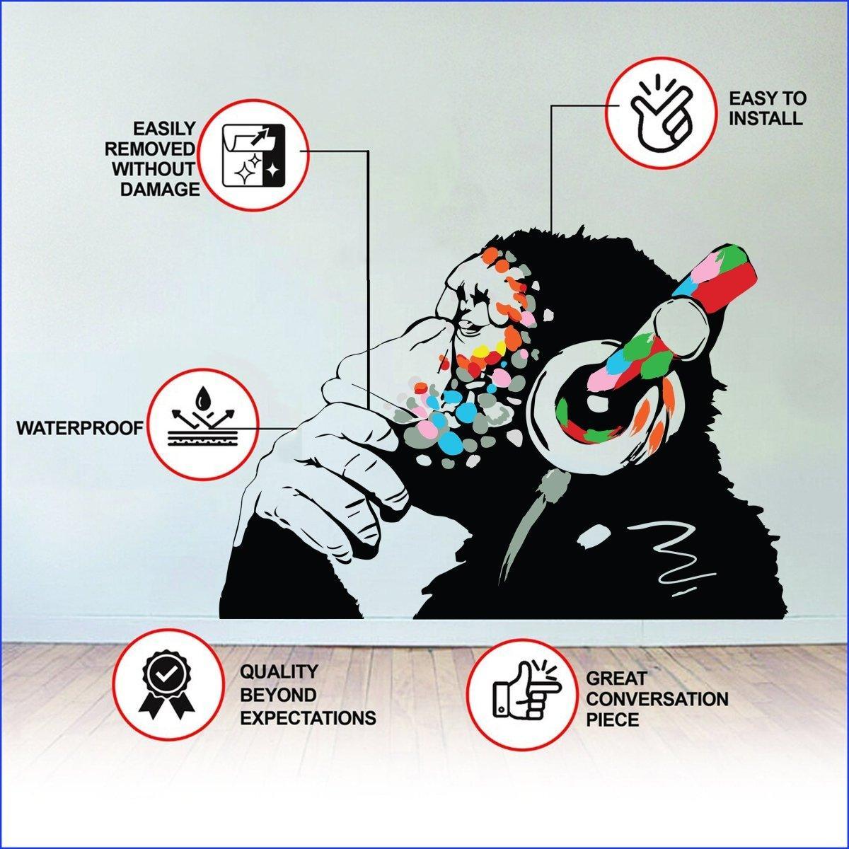 Cool contemplative monkey wall decal with colorful headphones, perfect for kids' room decoration.