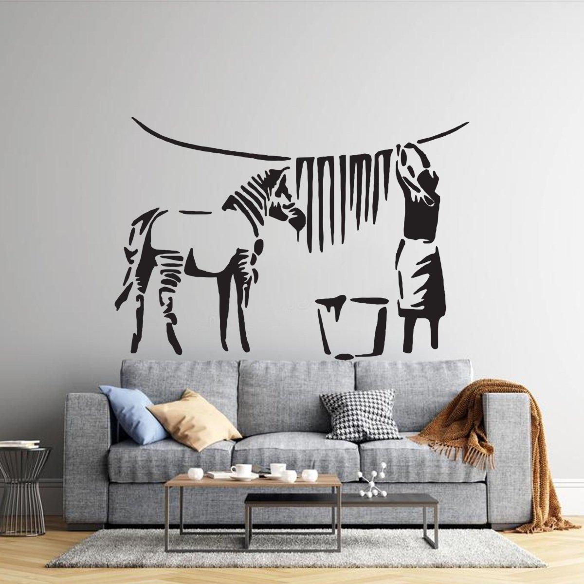 Urban street art zebra stripes wall decal above a modern couch in a stylish living space.