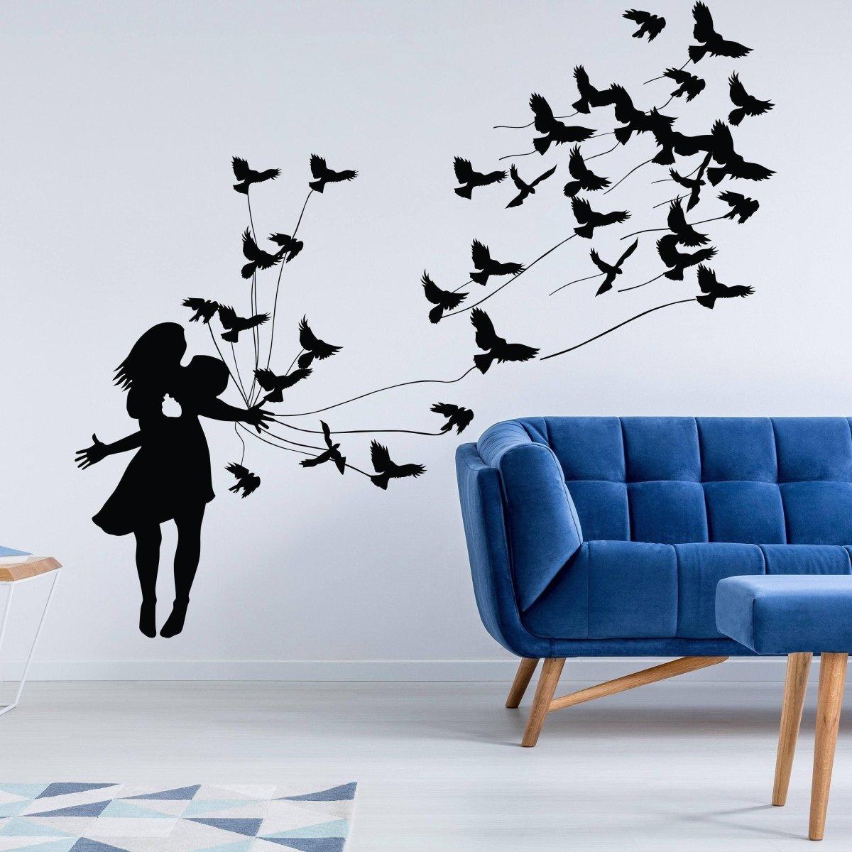 Artistic wall sticker of a girl surrounded by flying birds, enhancing modern home decor.