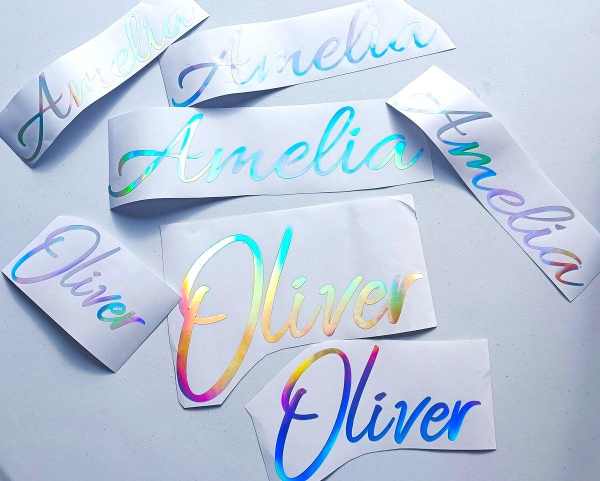 Personalized rainbow holographic vinyl decals with names Amelia and Oliver, colorful custom name stickers.