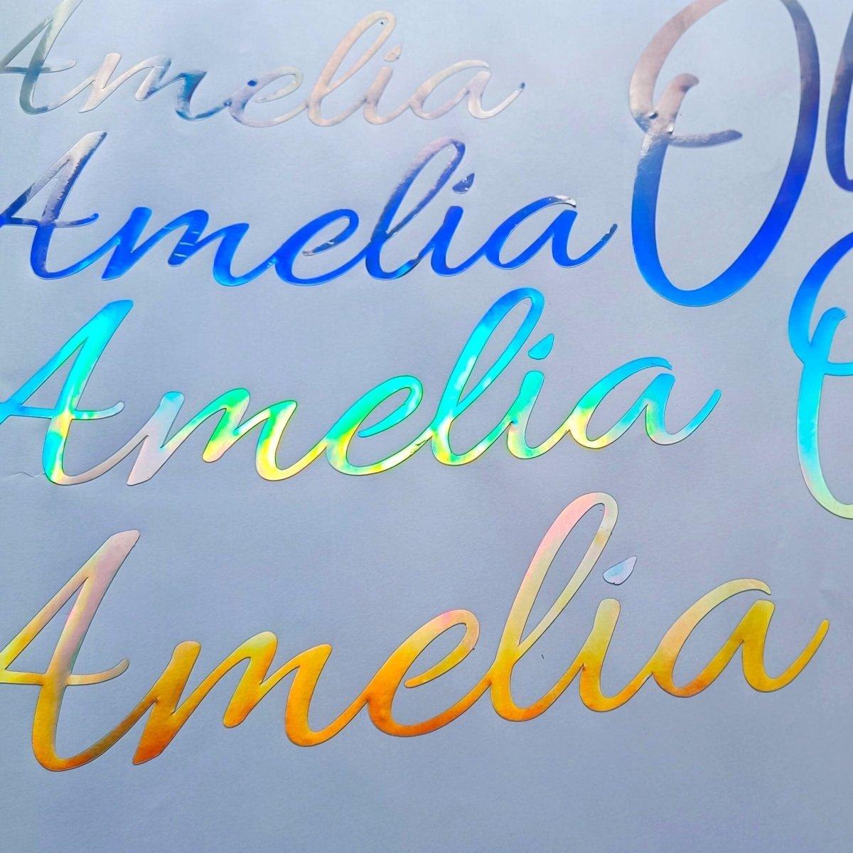Personalized rainbow holographic vinyl decals featuring the name Amelia in vibrant colors.