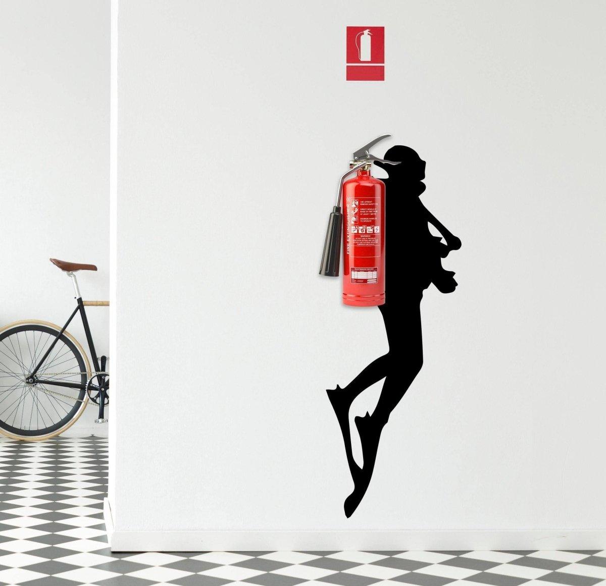 Wall sticker silhouette of a diver next to a fire extinguisher, adding a unique touch to interior decor.