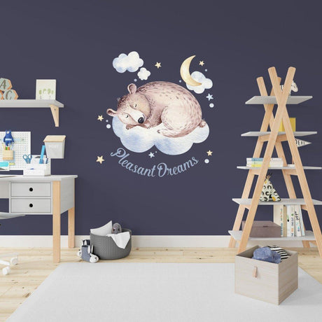 Adorable sleeping bear wall sticker with stars and moon, perfect for kids' room decor and creating a dreamy atmosphere.